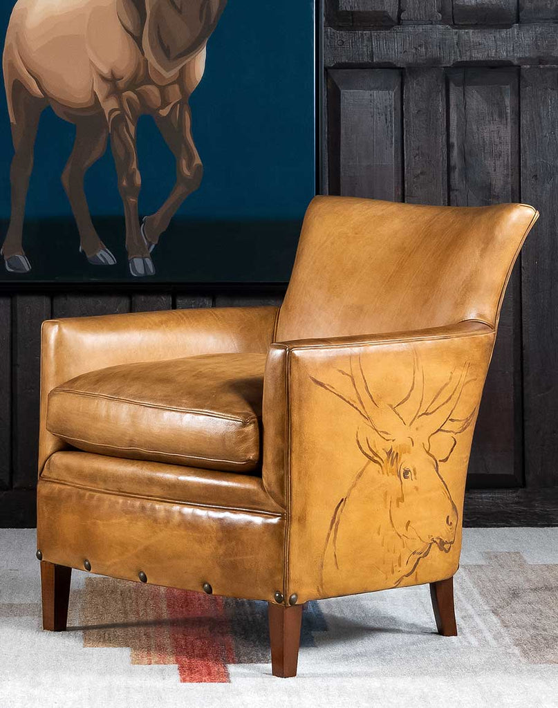 Wild Elk Leather Chair showcasing its rich full-grain leather upholstery and hand-painted elk petroglyphs.