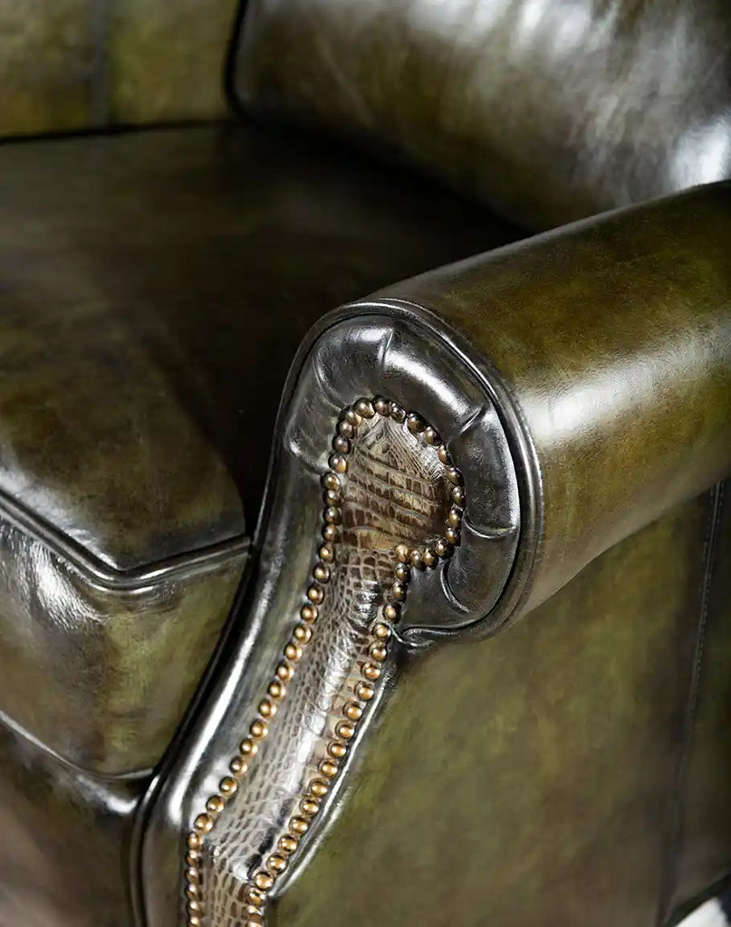 Close-up of the armrest on the Wild Moss Leather Recliner, highlighting the smooth curve and luxurious leather.