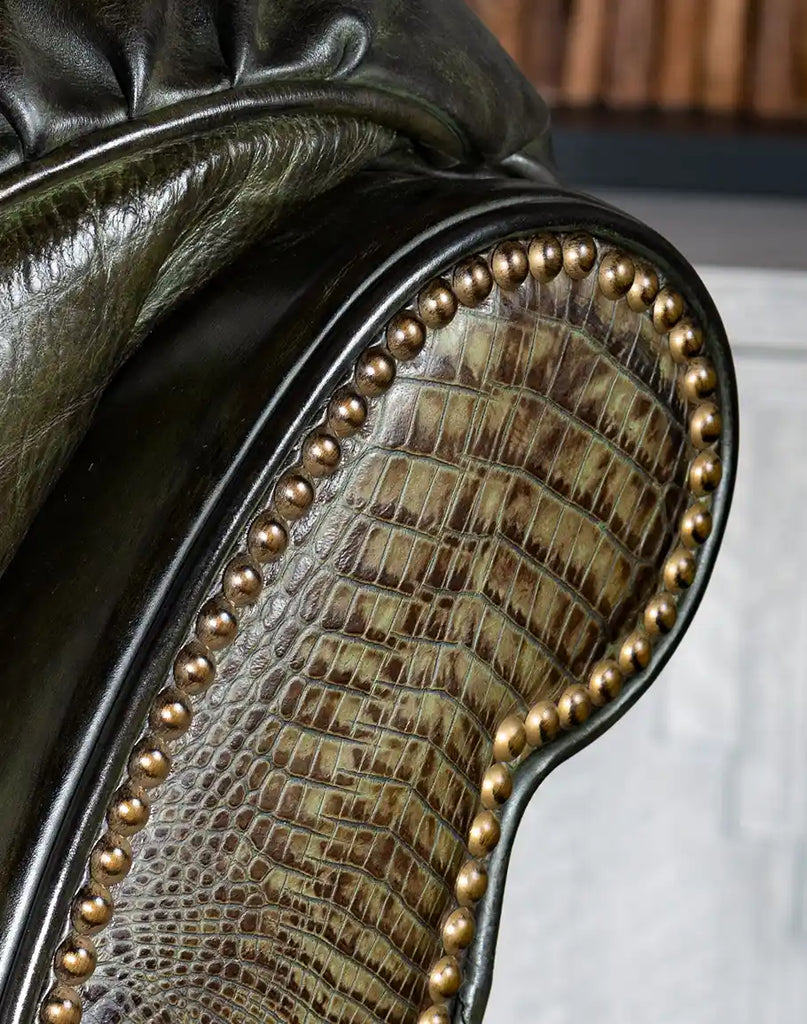 A close-up view of the nail tack detailing on the Wild Moss Leather Recliner, showcasing its intricate craftsmanship and classic design.