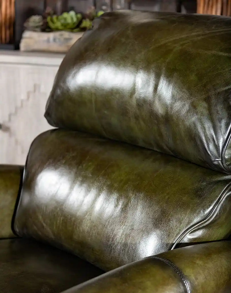 A detailed view of the plush, padded seating on the Wild Moss Leather Recliner, designed for ultimate comfort.