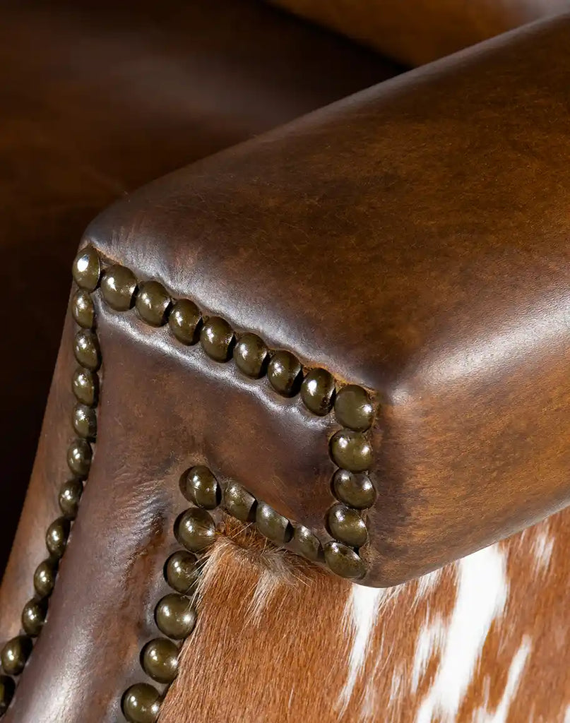 Close-up of the brass nail tacks on the Wrangler Leather Recliner, showcasing their intricate design and elegant craftsmanship.