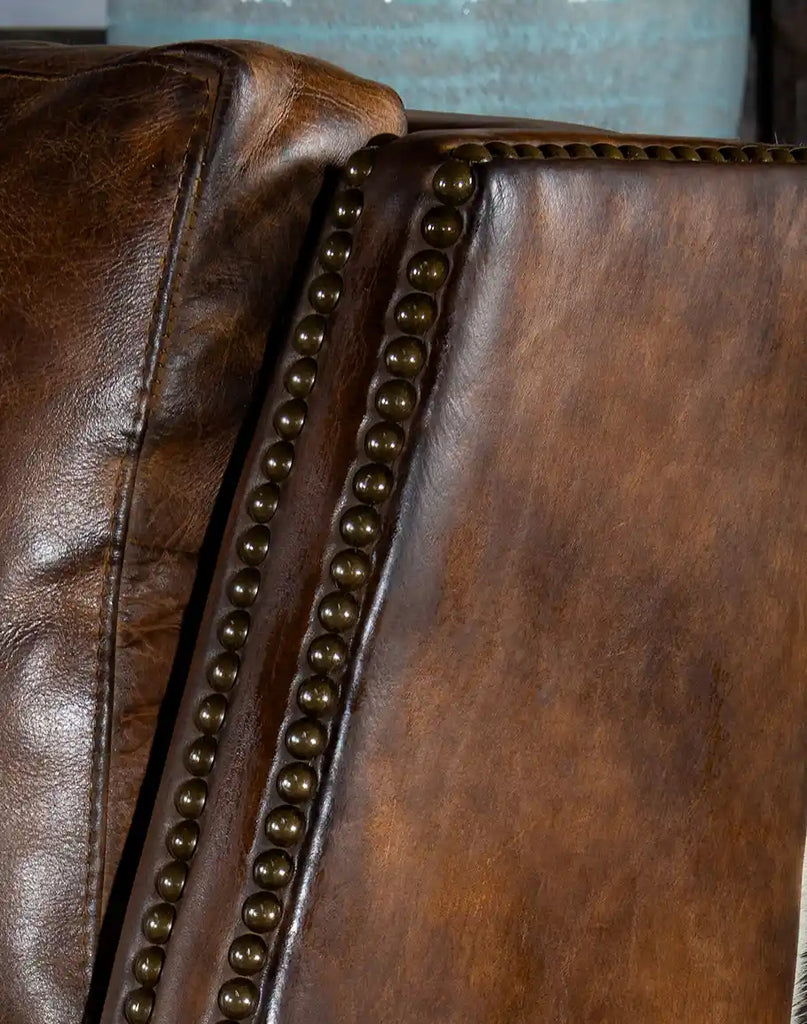 Close-up of the luxurious hand-burnished leather texture on the Wrangler Leather Recliner, showcasing its premium quality.