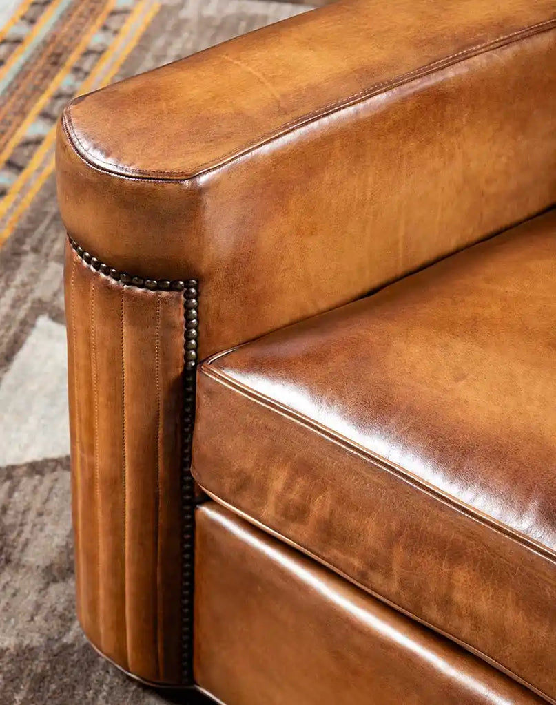 Close-up of the Yeager Chair's polished, hand-burnished leather details, enhancing its rustic elegance.