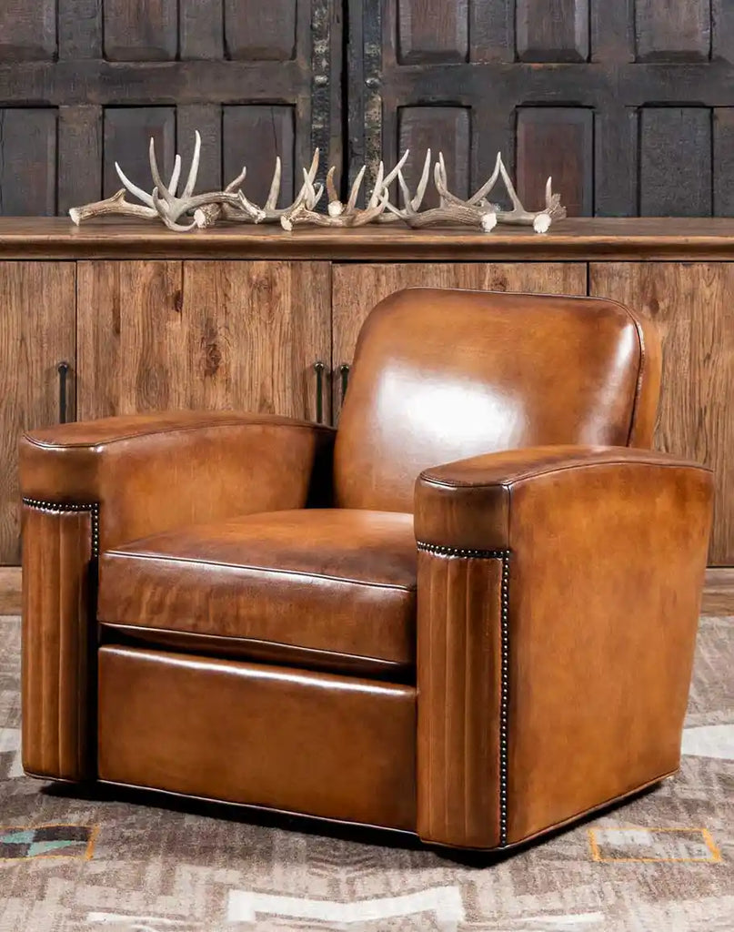 A luxurious Yeager Leather Swivel Chair crafted with full-grain hand-burnished leather, featuring channel-stitched detailing.