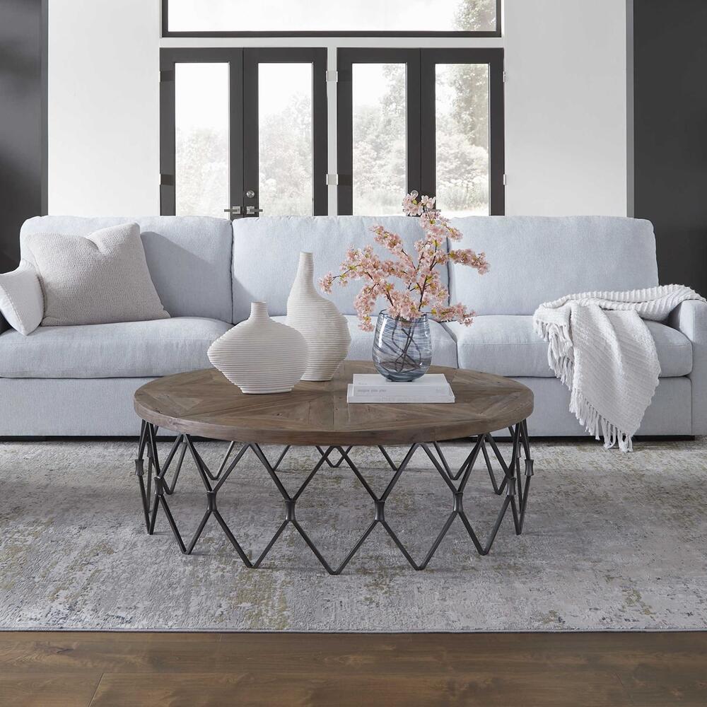 Zigzag coffee table featuring a reclaimed wood parquet top with a rustic finish and an aged iron chain link base for a bold, industrial look.