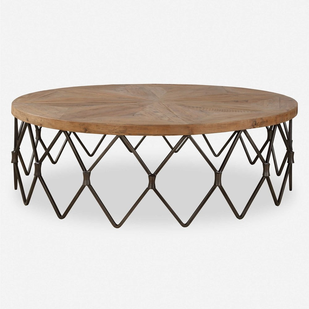 Unique coffee table design with a zigzag chain link base in aged iron and a reclaimed wood top featuring a parquet pattern.